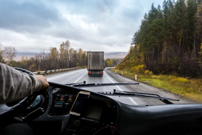 POV of driving a truck with another truck ahead